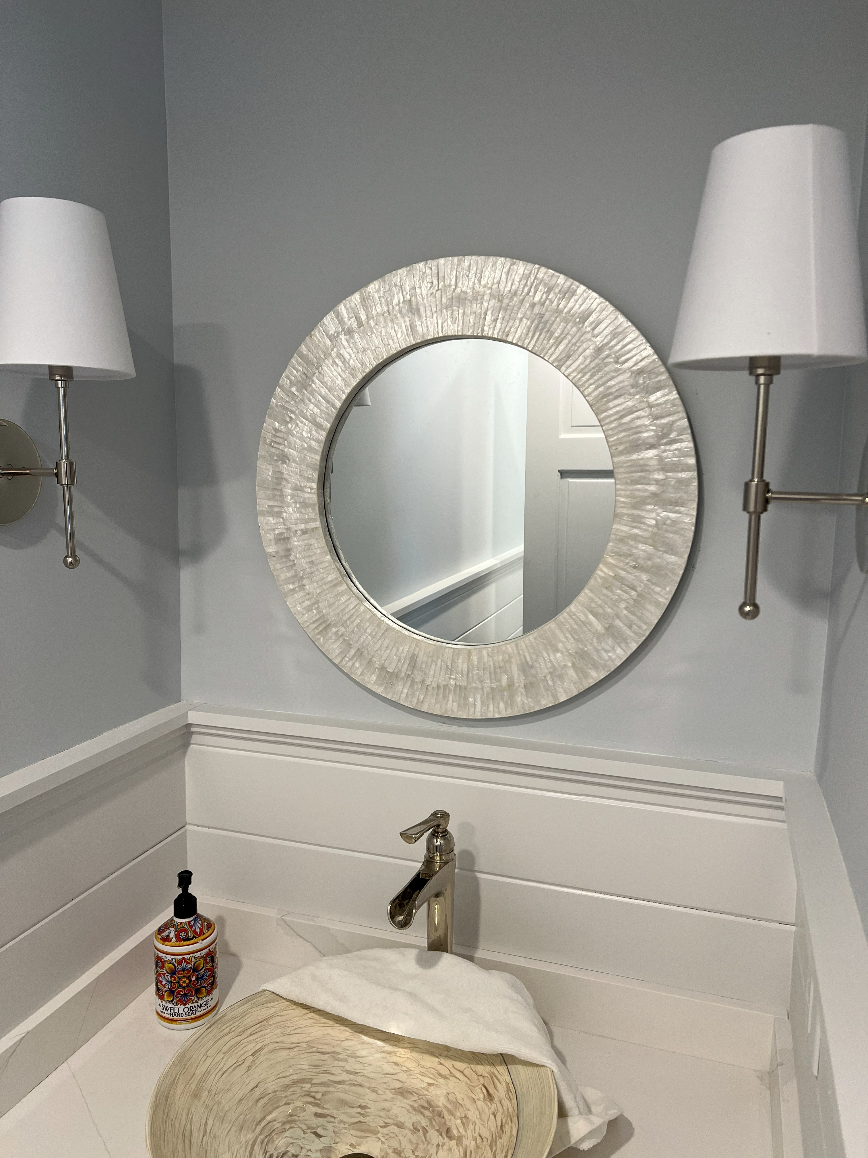Powder room vanity, wall paneling and trim.