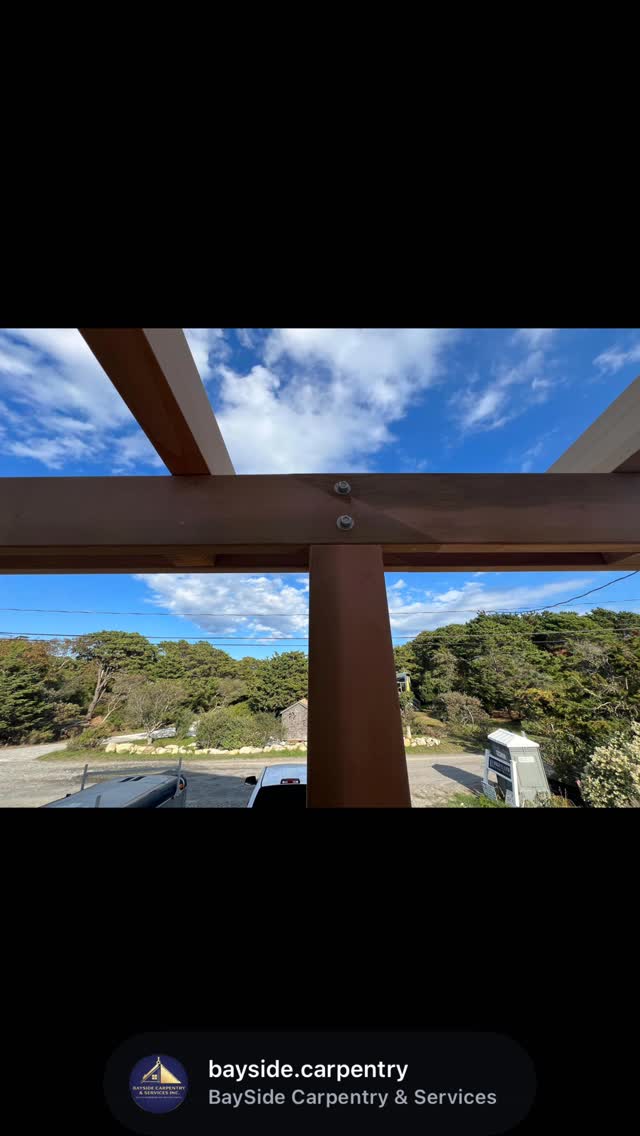 A close view of a pergola beam and post connection.