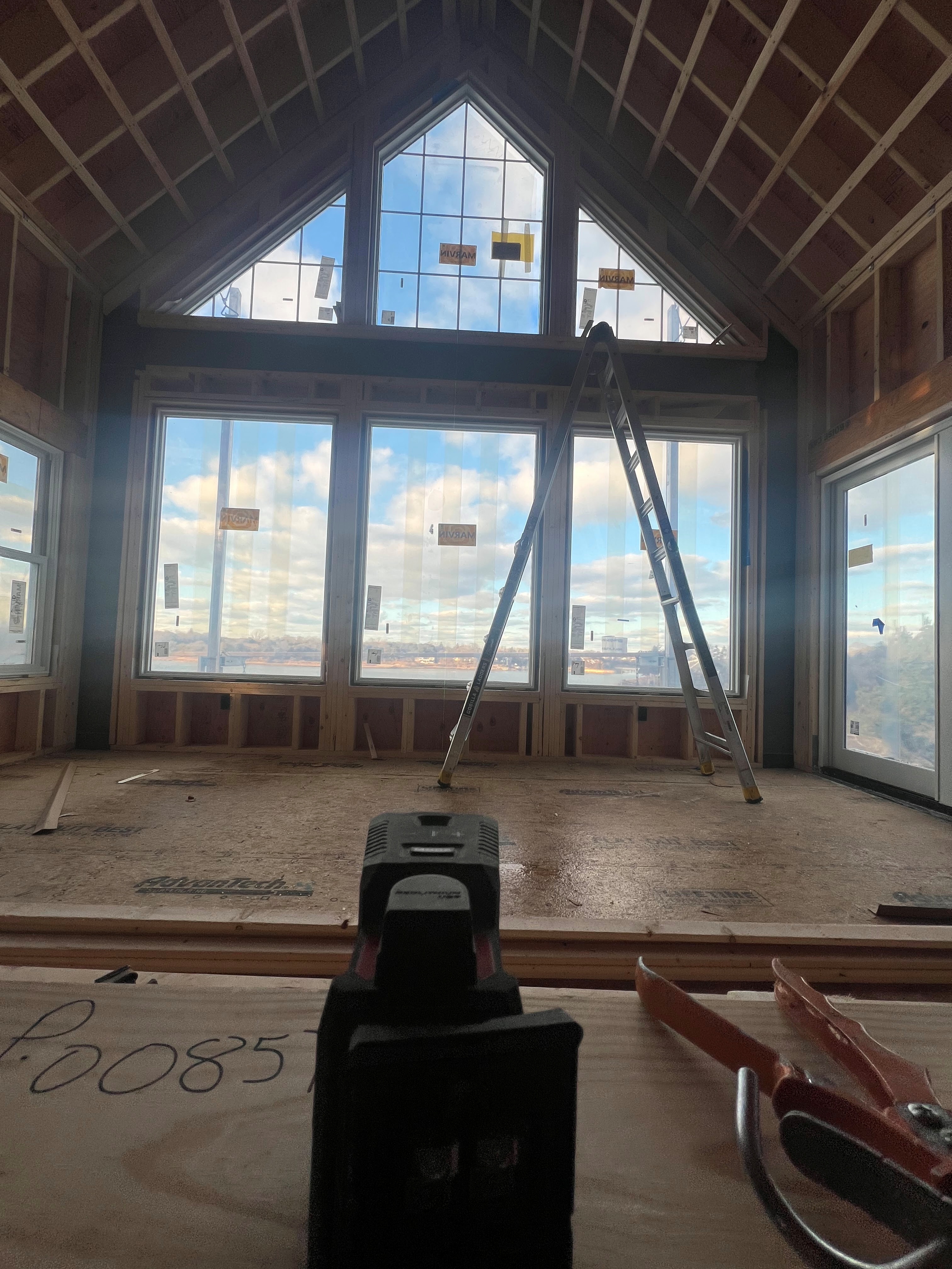 Large windows set within a framed gable wall.