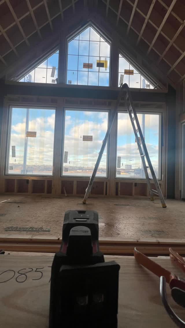 Large windows set within a framed gable wall.