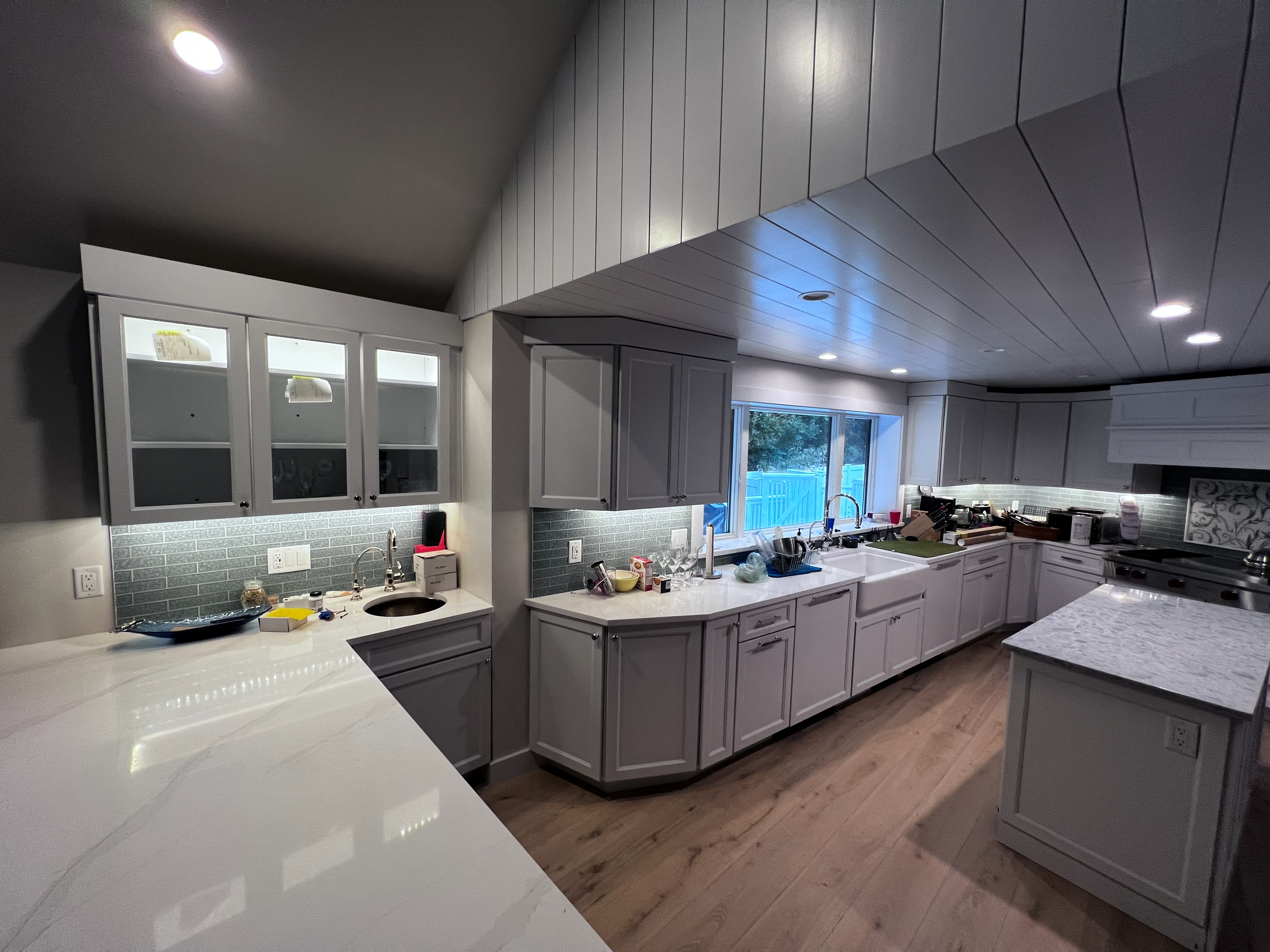 Kitchen cabinetry and ceiling paneling.