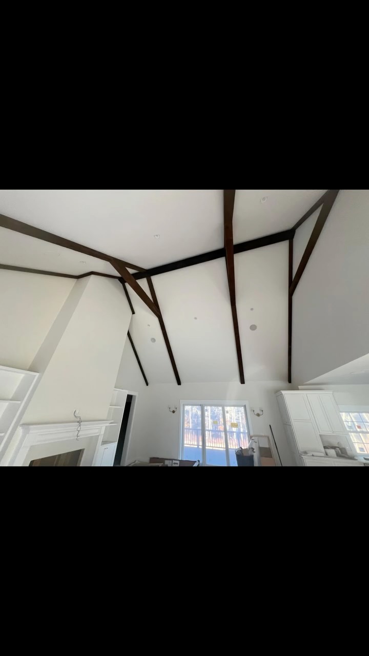 Dark wood ceiling beams and interior trim.